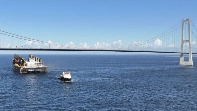 Giant Crane Ship Thialf Stoops to Pass Under Great Belt Bridge